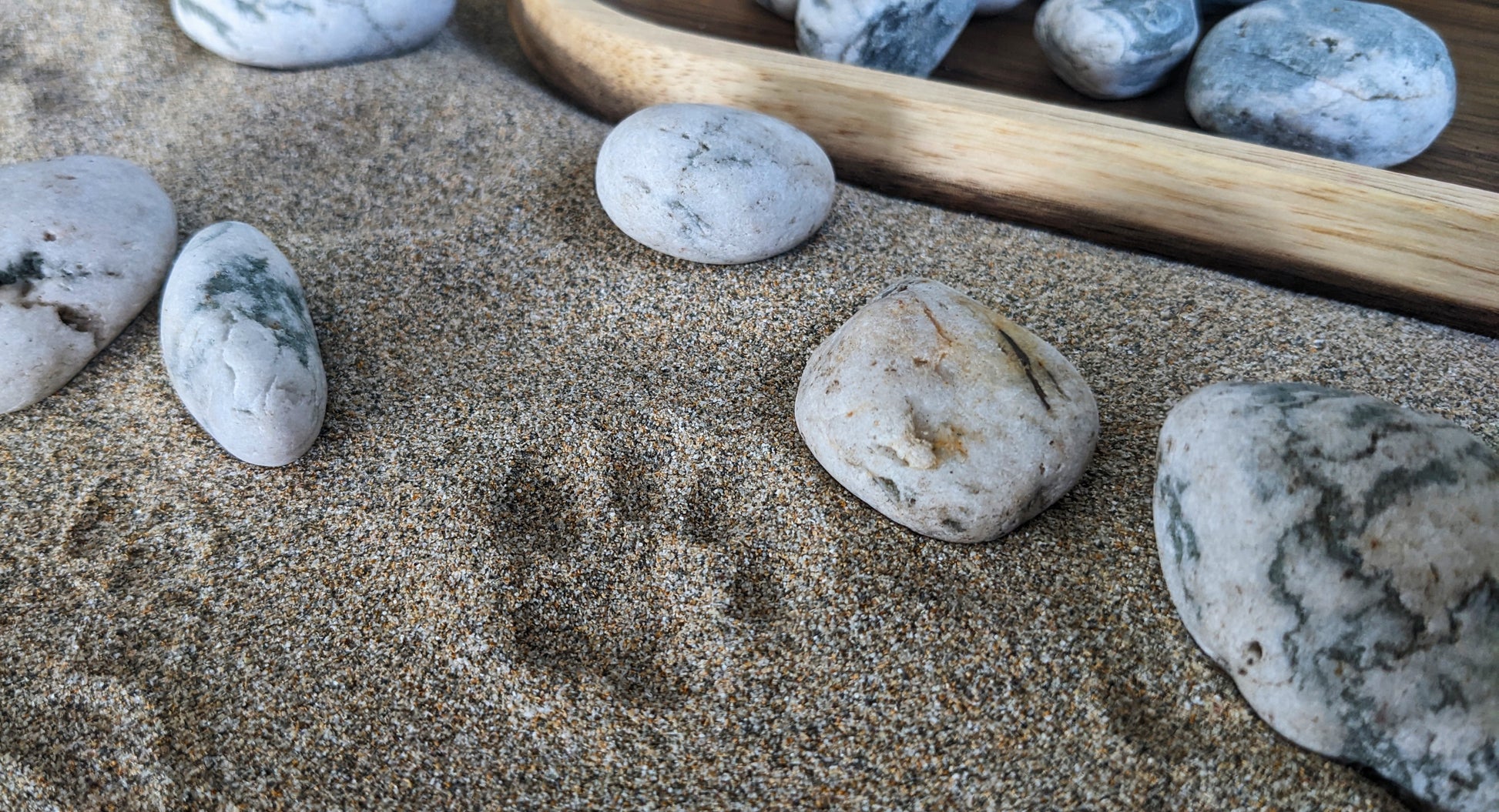 Close up shot of sand and pebbles 